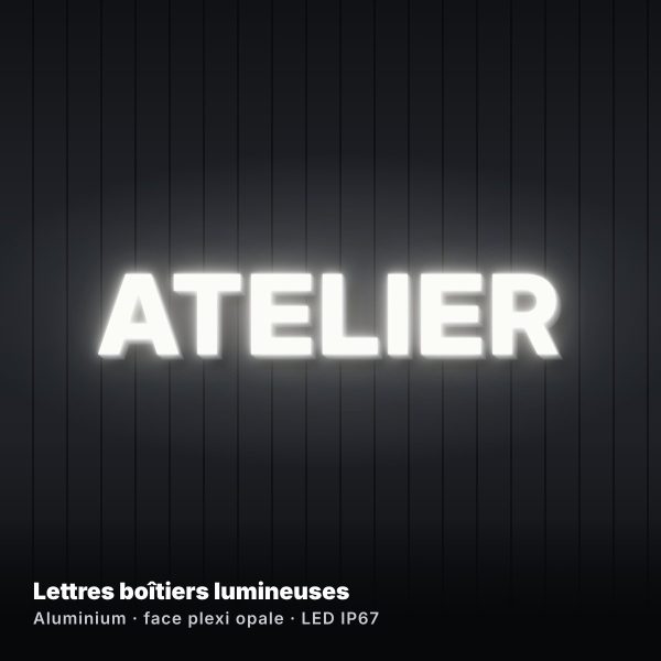 Lettres boîtiers lumineuses ATELIER éclairées sur façade en bardage